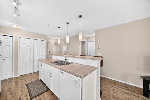 2133-700 Willowbrook Road Nw, Airdrie, AB - Indoor Photo Showing Kitchen With Double Sink