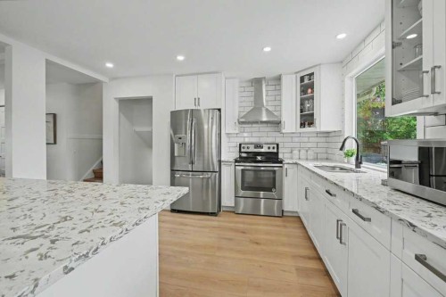 727 120 Avenue Sw, Calgary, AB - Indoor Photo Showing Kitchen With Stainless Steel Kitchen With Double Sink With Upgraded Kitchen