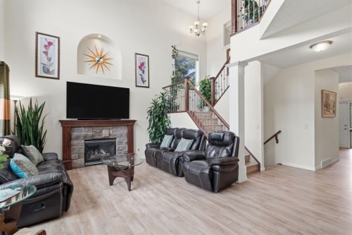 21 Royal Ridge Hill Nw, Calgary, AB - Indoor Photo Showing Living Room With Fireplace