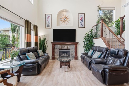 21 Royal Ridge Hill Nw, Calgary, AB - Indoor Photo Showing Living Room With Fireplace