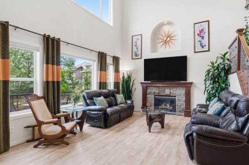 21 Royal Ridge Hill Nw, Calgary, AB - Indoor Photo Showing Living Room With Fireplace