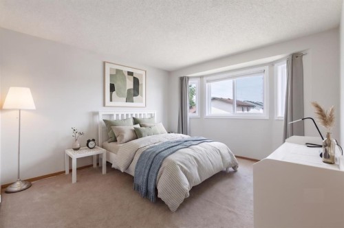 151 Rivercrest Close Se, Calgary, AB - Indoor Photo Showing Bedroom