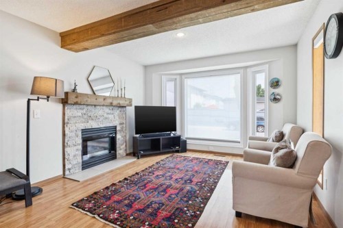 151 Rivercrest Close Se, Calgary, AB - Indoor Photo Showing Living Room With Fireplace