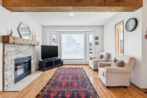 151 Rivercrest Close Se, Calgary, AB - Indoor Photo Showing Living Room With Fireplace