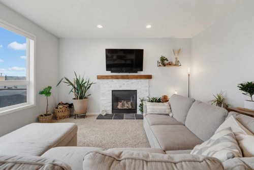 71 Pantego Way Nw, Calgary, AB - Indoor Photo Showing Living Room With Fireplace