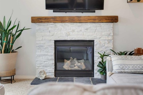 71 Pantego Way Nw, Calgary, AB - Indoor Photo Showing Living Room With Fireplace