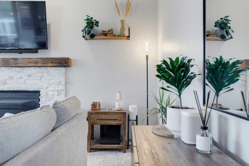 71 Pantego Way Nw, Calgary, AB - Indoor Photo Showing Other Room With Fireplace
