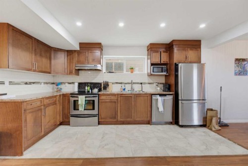 71 Pantego Way Nw, Calgary, AB - Indoor Photo Showing Kitchen With Stainless Steel Kitchen With Double Sink