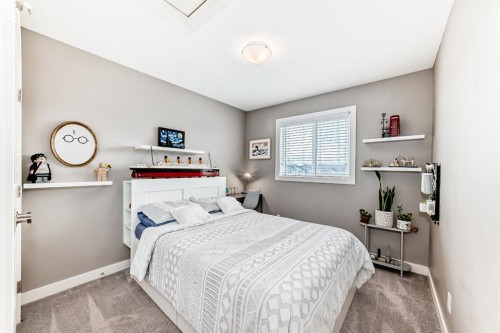 38 Precedence Glen, Cochrane, AB - Indoor Photo Showing Bedroom