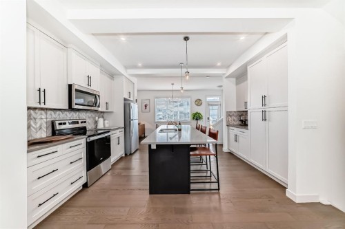 38 Precedence Glen, Cochrane, AB - Indoor Photo Showing Kitchen With Upgraded Kitchen