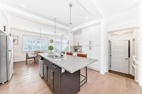 38 Precedence Glen, Cochrane, AB - Indoor Photo Showing Kitchen With Double Sink