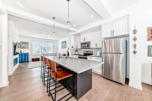 38 Precedence Glen, Cochrane, AB - Indoor Photo Showing Kitchen With Upgraded Kitchen
