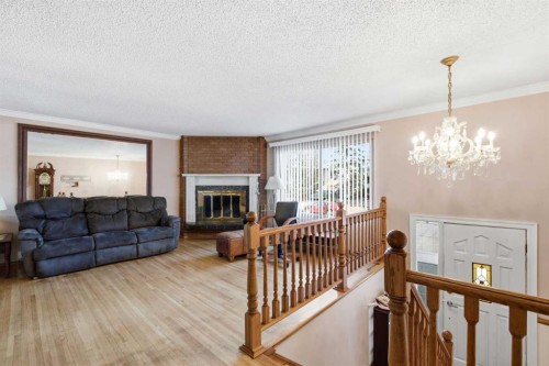 16 Dalroy Crescent Nw, Calgary, AB - Indoor Photo Showing Other Room With Fireplace