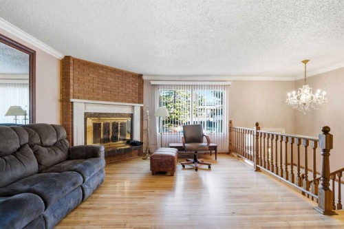 16 Dalroy Crescent Nw, Calgary, AB - Indoor Photo Showing Living Room With Fireplace