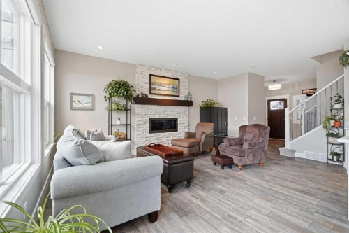 27 Sundown Way, Cochrane, AB - Indoor Photo Showing Living Room With Fireplace
