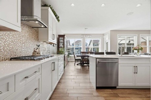 27 Sundown Way, Cochrane, AB - Indoor Photo Showing Kitchen With Upgraded Kitchen
