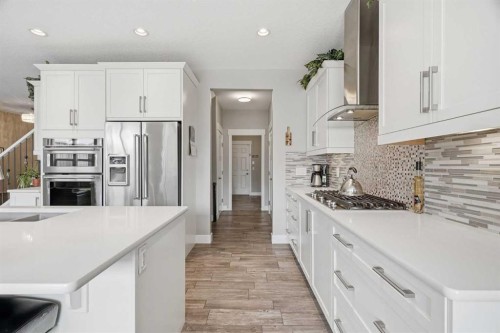 27 Sundown Way, Cochrane, AB - Indoor Photo Showing Kitchen With Stainless Steel Kitchen With Upgraded Kitchen