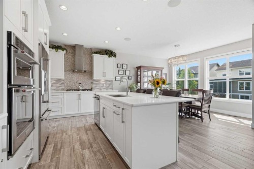 27 Sundown Way, Cochrane, AB - Indoor Photo Showing Kitchen With Upgraded Kitchen