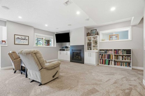 27 Sundown Way, Cochrane, AB - Indoor With Fireplace