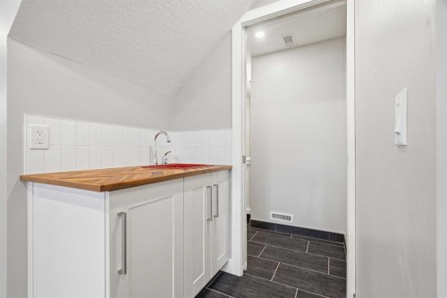 27 Sundown Way, Cochrane, AB - Indoor Photo Showing Other Room