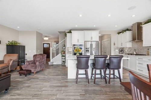 27 Sundown Way, Cochrane, AB - Indoor Photo Showing Kitchen With Stainless Steel Kitchen With Upgraded Kitchen