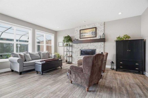 27 Sundown Way, Cochrane, AB - Indoor Photo Showing Living Room With Fireplace