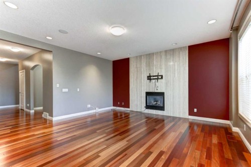 406 Silverado Boulevard Sw, Calgary, AB - Indoor With Fireplace