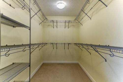406 Silverado Boulevard Sw, Calgary, AB - Indoor With Storage