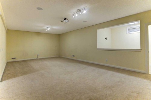406 Silverado Boulevard Sw, Calgary, AB - Indoor Photo Showing Other Room