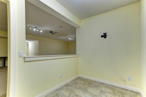 406 Silverado Boulevard Sw, Calgary, AB - Indoor Photo Showing Other Room