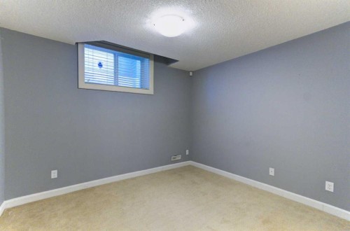 406 Silverado Boulevard Sw, Calgary, AB - Indoor Photo Showing Other Room