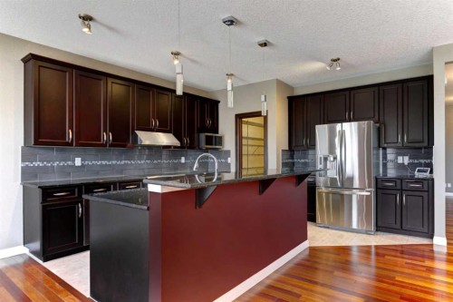 406 Silverado Boulevard Sw, Calgary, AB - Indoor Photo Showing Kitchen With Upgraded Kitchen