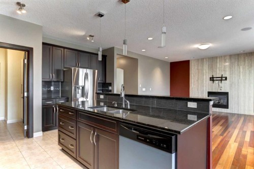 406 Silverado Boulevard Sw, Calgary, AB - Indoor Photo Showing Kitchen With Double Sink With Upgraded Kitchen
