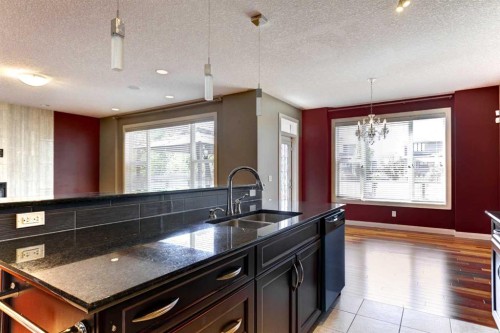 406 Silverado Boulevard Sw, Calgary, AB - Indoor Photo Showing Kitchen With Double Sink