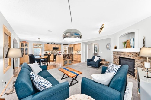 206 Panamount Grove Nw, Calgary, AB - Indoor Photo Showing Living Room With Fireplace