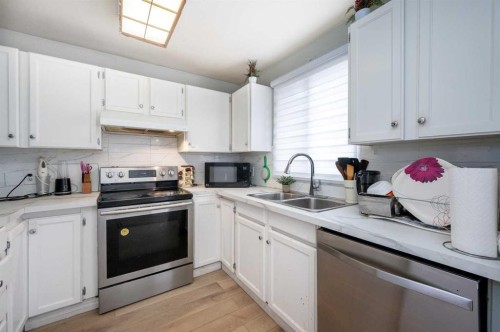 356 Falmere Road Ne, Calgary, AB - Indoor Photo Showing Kitchen With Double Sink