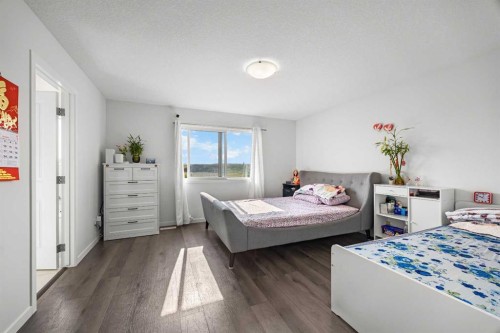 87 Harvest Grove Common Ne, Calgary, AB - Indoor Photo Showing Bedroom