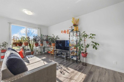 87 Harvest Grove Common Ne, Calgary, AB - Indoor Photo Showing Living Room