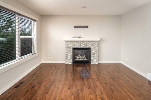 38 Nolanfield Road Nw, Calgary, AB - Indoor Photo Showing Living Room With Fireplace