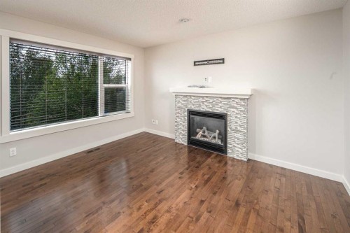 38 Nolanfield Road Nw, Calgary, AB - Indoor Photo Showing Living Room With Fireplace