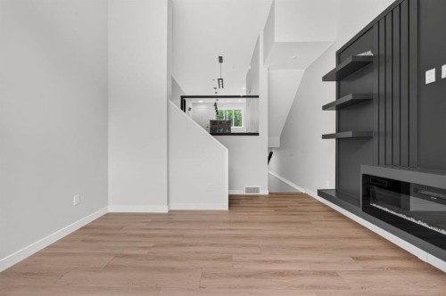 2022 12 Avenue Sw, Calgary, AB - Indoor Photo Showing Other Room With Fireplace