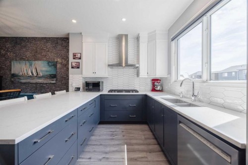 85 Legacy Glen Point Se, Calgary, AB - Indoor Photo Showing Kitchen With Fireplace With Double Sink