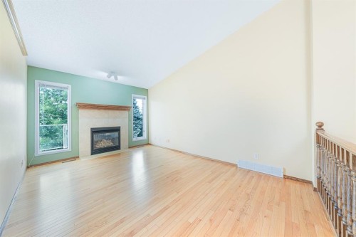 22 Douglas Woods Park Se, Calgary, AB - Indoor Photo Showing Living Room With Fireplace