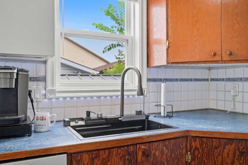 7 Falshire Close Ne, Calgary, AB - Indoor Photo Showing Kitchen With Double Sink