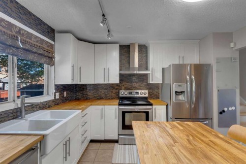 35 Rundlemere Place Ne, Calgary, AB - Indoor Photo Showing Kitchen With Double Sink