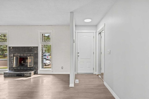 875 Pinecliff Drive Ne, Calgary, AB - Indoor With Fireplace