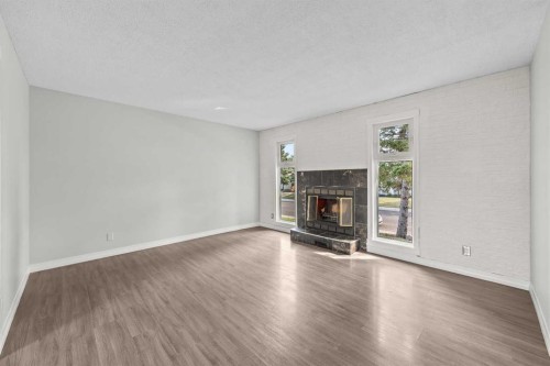 875 Pinecliff Drive Ne, Calgary, AB - Indoor Photo Showing Living Room With Fireplace