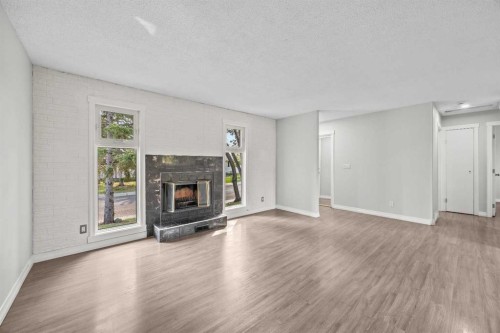 875 Pinecliff Drive Ne, Calgary, AB - Indoor Photo Showing Living Room With Fireplace