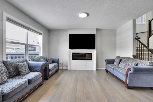 92 Red Embers Terrace Ne, Calgary, AB - Indoor Photo Showing Living Room With Fireplace