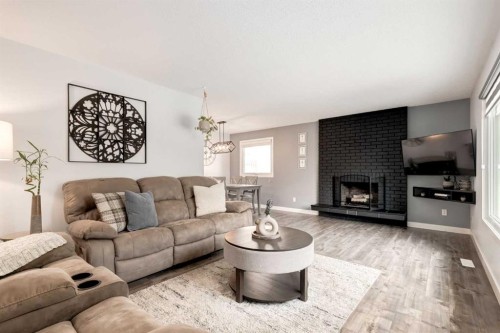 6223 Silver Ridge Drive Nw, Calgary, AB - Indoor Photo Showing Living Room With Fireplace